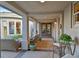 Covered patio with elegant seating, creating a sophisticated and comfortable outdoor space at 69 Tapadero Ln, Las Vegas, NV 89135