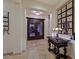 Elegant foyer featuring ornate double doors, marble floors, and an antique table at 69 Tapadero Ln, Las Vegas, NV 89135