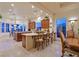 Open kitchen features custom cabinets, a breakfast bar, and backyard views at 69 Tapadero Ln, Las Vegas, NV 89135