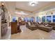 Open concept living room and dining area with large windows and natural light at 69 Tapadero Ln, Las Vegas, NV 89135