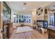 Inviting living room features a modern fireplace, curved windows, and stylish décor at 69 Tapadero Ln, Las Vegas, NV 89135