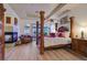 Relaxing main bedroom boasts a fireplace, hardwood flooring, and ample natural light at 69 Tapadero Ln, Las Vegas, NV 89135
