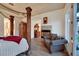 Cozy main bedroom with hardwood floors, fireplace, and a comfortable sitting area at 69 Tapadero Ln, Las Vegas, NV 89135