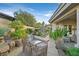 Outdoor kitchen with built-in BBQ, perfect for entertaining in this beautifully landscaped backyard at 69 Tapadero Ln, Las Vegas, NV 89135