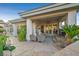 Covered patio area with comfortable seating and lush greenery, creating a relaxing outdoor space at 69 Tapadero Ln, Las Vegas, NV 89135