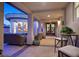 Cozy covered patio with comfortable seating area and outdoor decor at 69 Tapadero Ln, Las Vegas, NV 89135