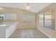 Bright breakfast nook with natural lighting, tiled floors, and modern ceiling fan at 6920 Haven Hollow Ave, Las Vegas, NV 89130