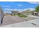 Well maintained exterior featuring a paver driveway and lush front yard landscaping at 6920 Haven Hollow Ave, Las Vegas, NV 89130
