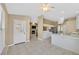 Open-concept space with tiled floors connecting kitchen and living area at 6920 Haven Hollow Ave, Las Vegas, NV 89130