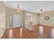 The living room features hardwood floors, a ceiling fan, and decorative stained glass windows by the entry at 6920 Haven Hollow Ave, Las Vegas, NV 89130