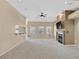 Spacious living room with carpet, a fireplace, a large screen tv, and views of other rooms at 6920 Haven Hollow Ave, Las Vegas, NV 89130