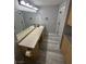 Bathroom with double vanity, and wood look tile floors at 6955 N Durango Dr # 1013, Las Vegas, NV 89149