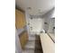 Bathroom with tub-shower combo, new floors, and long vanity at 6955 N Durango Dr # 1013, Las Vegas, NV 89149