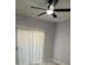 Bedroom with a ceiling fan and lots of light from the sliding glass door at 6955 N Durango Dr # 1013, Las Vegas, NV 89149