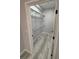 A walk-in closet featuring wood grain floors, white walls, and wire shelving at 6955 N Durango Dr # 1013, Las Vegas, NV 89149