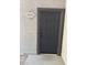 Apartment front door with visible unit number and dark gray door at 6955 N Durango Dr # 1013, Las Vegas, NV 89149
