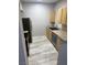 View of the kitchen with wooden cabinets and stainless steel appliances at 6955 N Durango Dr # 1013, Las Vegas, NV 89149