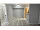 Open floor plan living and dining room with wood look floors at 6955 N Durango Dr # 1013, Las Vegas, NV 89149