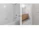 Full bathroom view including tub, tile walls, and vanity at 6955 N Durango Dr # 2054, Las Vegas, NV 89149