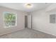 Carpeted bedroom has natural light, and closet access at 6955 N Durango Dr # 2054, Las Vegas, NV 89149