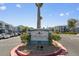 Welcoming entrance to The Regent at Town Center with mature landscaping and clear signage at 6955 N Durango Dr # 2054, Las Vegas, NV 89149