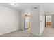 Spacious living area with neutral carpet, connecting to the kitchen and bathroom at 6955 N Durango Dr # 2054, Las Vegas, NV 89149
