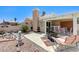 Charming backyard with covered patio, barbecue area, water fountain, and comfortable seating at 7019 Shadow Crest Dr, Las Vegas, NV 89119