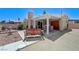 Spacious backyard featuring a covered patio, grill, bench swing, and low-maintenance landscaping at 7019 Shadow Crest Dr, Las Vegas, NV 89119