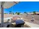 Charming covered patio with seating area, decorative fountain, and well-maintained landscaping at 7019 Shadow Crest Dr, Las Vegas, NV 89119
