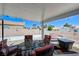 Beautiful backyard featuring a covered patio, outdoor dining set, and a cozy seating area at 7019 Shadow Crest Dr, Las Vegas, NV 89119