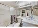 The bathroom has a shower-tub combo and a vanity with a mirror at 7019 Shadow Crest Dr, Las Vegas, NV 89119