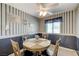 Charming dining area offers a ceiling fan, a window view, and comfortable seating at 7019 Shadow Crest Dr, Las Vegas, NV 89119