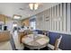 Cozy dining area featuring a round wooden table and chairs next to the kitchen at 7019 Shadow Crest Dr, Las Vegas, NV 89119