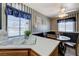 View of kitchen features a breakfast nook with a round table and large window at 7019 Shadow Crest Dr, Las Vegas, NV 89119