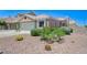 Charming home featuring desert landscaping, a two-car garage, and a welcoming front entrance at 7019 Shadow Crest Dr, Las Vegas, NV 89119