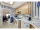 Kitchen showcasing the stove, dishwasher, and open access to the living area at 7019 Shadow Crest Dr, Las Vegas, NV 89119