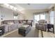 Bright living room with vaulted ceilings, a sectional sofa, and access to the outdoors at 7019 Shadow Crest Dr, Las Vegas, NV 89119