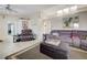 Open concept living room with comfortable seating, vaulted ceilings, and ample natural light at 7019 Shadow Crest Dr, Las Vegas, NV 89119