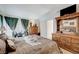 Spacious main bedroom with a bed, dresser, and natural light at 7019 Shadow Crest Dr, Las Vegas, NV 89119