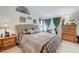 Comfortable main bedroom featuring a king-size bed and wood furnishings at 7019 Shadow Crest Dr, Las Vegas, NV 89119