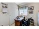 Office area featuring a desk, cabinets, and a sliding closet door at 7019 Shadow Crest Dr, Las Vegas, NV 89119