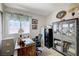 Office area featuring a wooden desk, multiple filing cabinets, and decor at 7019 Shadow Crest Dr, Las Vegas, NV 89119