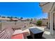 This patio features a bench, small fountain, and fire pit table at 7019 Shadow Crest Dr, Las Vegas, NV 89119