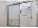Shower stall with patterned glass doors, built-in shelves, and chrome fixtures at 7019 Shadow Crest Dr, Las Vegas, NV 89119
