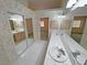 Bathroom with double sinks, decorative mirrors, and tiled countertops at 710 Tomahawk Ct, Pahrump, NV 89060