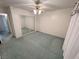 Bedroom featuring a ceiling fan, mirrored closet doors, and neutral paint at 710 Tomahawk Ct, Pahrump, NV 89060