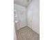 Clean entryway with tiled flooring and white interior doors for a simple, elegant welcome at 710 Tomahawk Ct, Pahrump, NV 89060