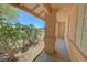 Inviting front porch features desert landscaping, a shade tree, and a welcoming outdoor space at 710 Tomahawk Ct, Pahrump, NV 89060
