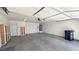 Spacious two-car garage with ample storage and a water heater at 710 Tomahawk Ct, Pahrump, NV 89060