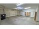 Spacious two-car garage with ample storage cabinets and shelving at 710 Tomahawk Ct, Pahrump, NV 89060